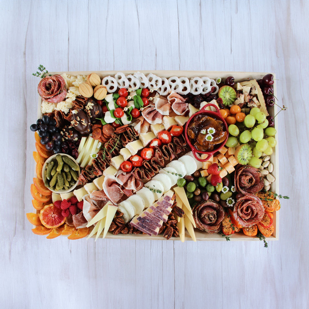 Signature charcuterie board with premium cured meats, artisan cheeses, crackers, and gourmet accompaniments – Board and Blossom, Greater Boston delivery